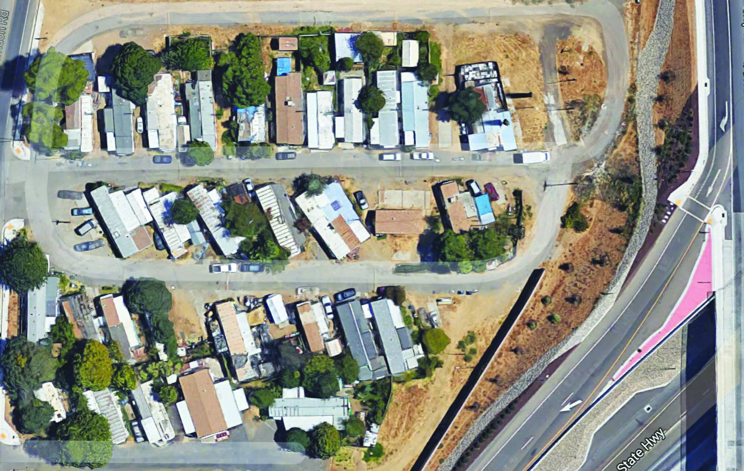 Figure 3 is an aerial view photograph showing the 30 mobile homes remaining at the mobile home park.